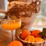 Fresh orange juice and fruit at breakfast