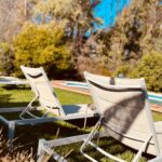 Sun loungers beside the pool at Finca W