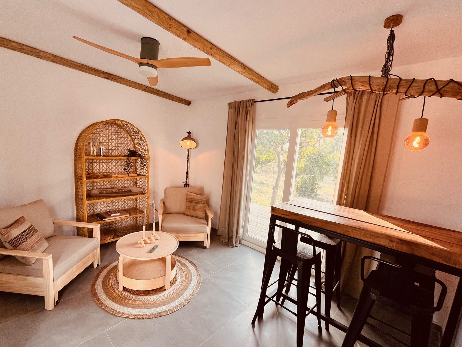W Studio living area with rattan shelving and morning light